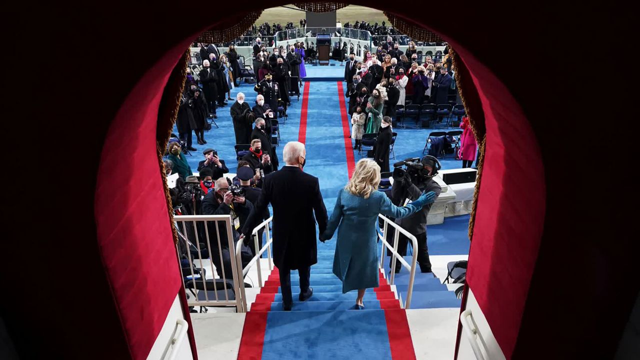 January 20: Joe Biden and his wife, Jill, arrive at his inauguration. Biden pledged to be a president for all Americans — even those who did not support his campaign. "Today, on this January day, my whole soul is in this: bringing America together, uniting our people, uniting our nation," he said in his inaugural address.