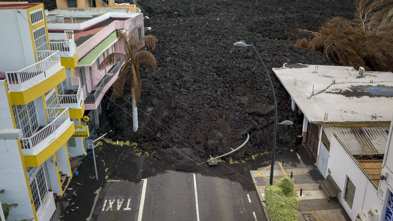 New lava flowing from Spain's Cumbre Vieja volcano destroys homes and infrastructure on the Canary Island of La Palma on Monday. 