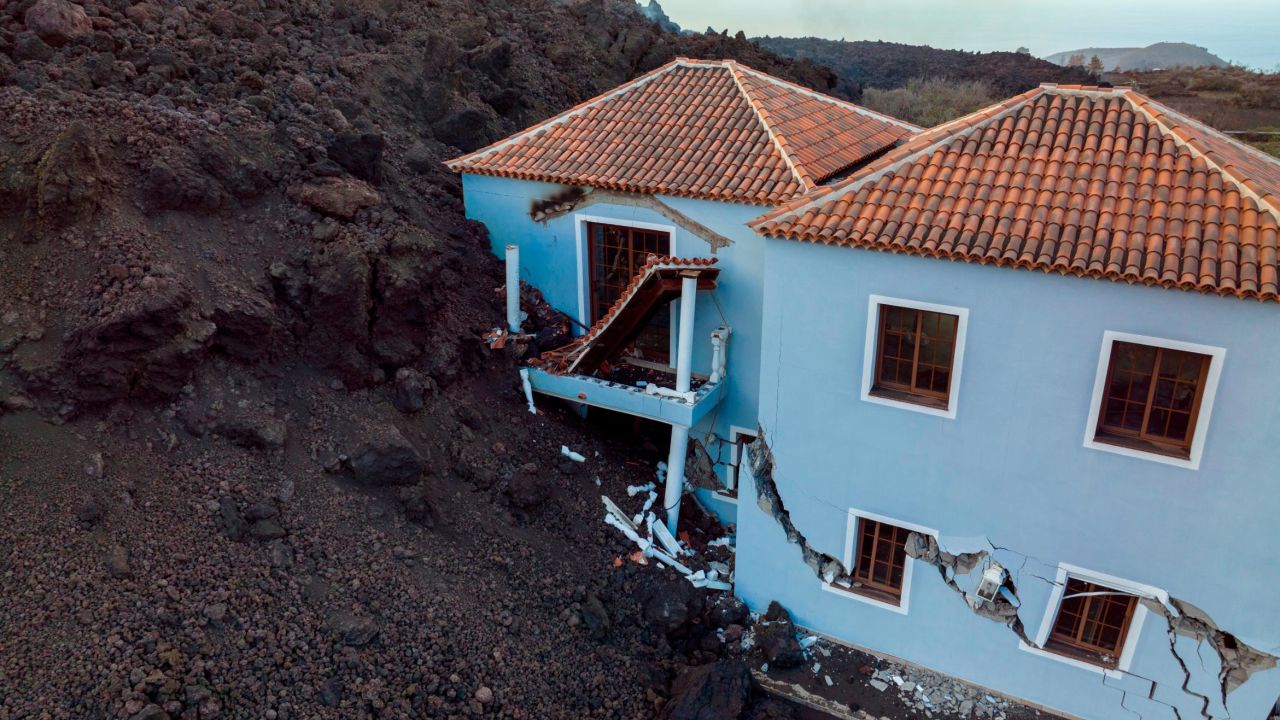 A house, destroyed by lava from the Cumbre Vieja volcano, is seen on the Canary Island of La Palma on Tuesday. 
