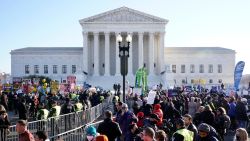 People demonstrate in front of the U.S. Supreme Court Wednesday, Dec. 1, 2021, in Washington, as the court hears arguments in a case from Mississippi, where a 2018 law would ban abortions after 15 weeks of pregnancy, well before viability.