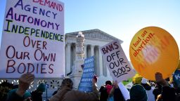 Protesters demonstrate in front of the US Supreme Court in Washington, DC, on December 1, 2021. The justices weigh whether to uphold a Mississippi law that bans abortion after 15 weeks and overrule the 1973 Roe v. Wade decision.