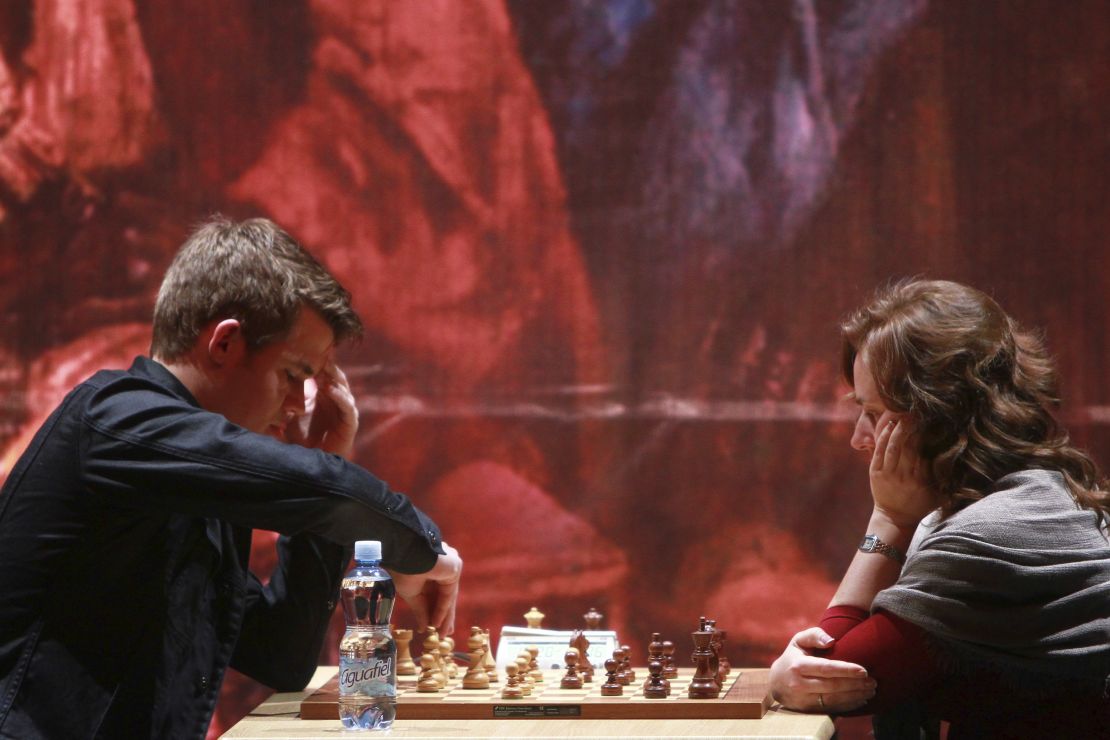 Magnus Carlsen from Norway and Judit Polgar from Hungary play in 2012.