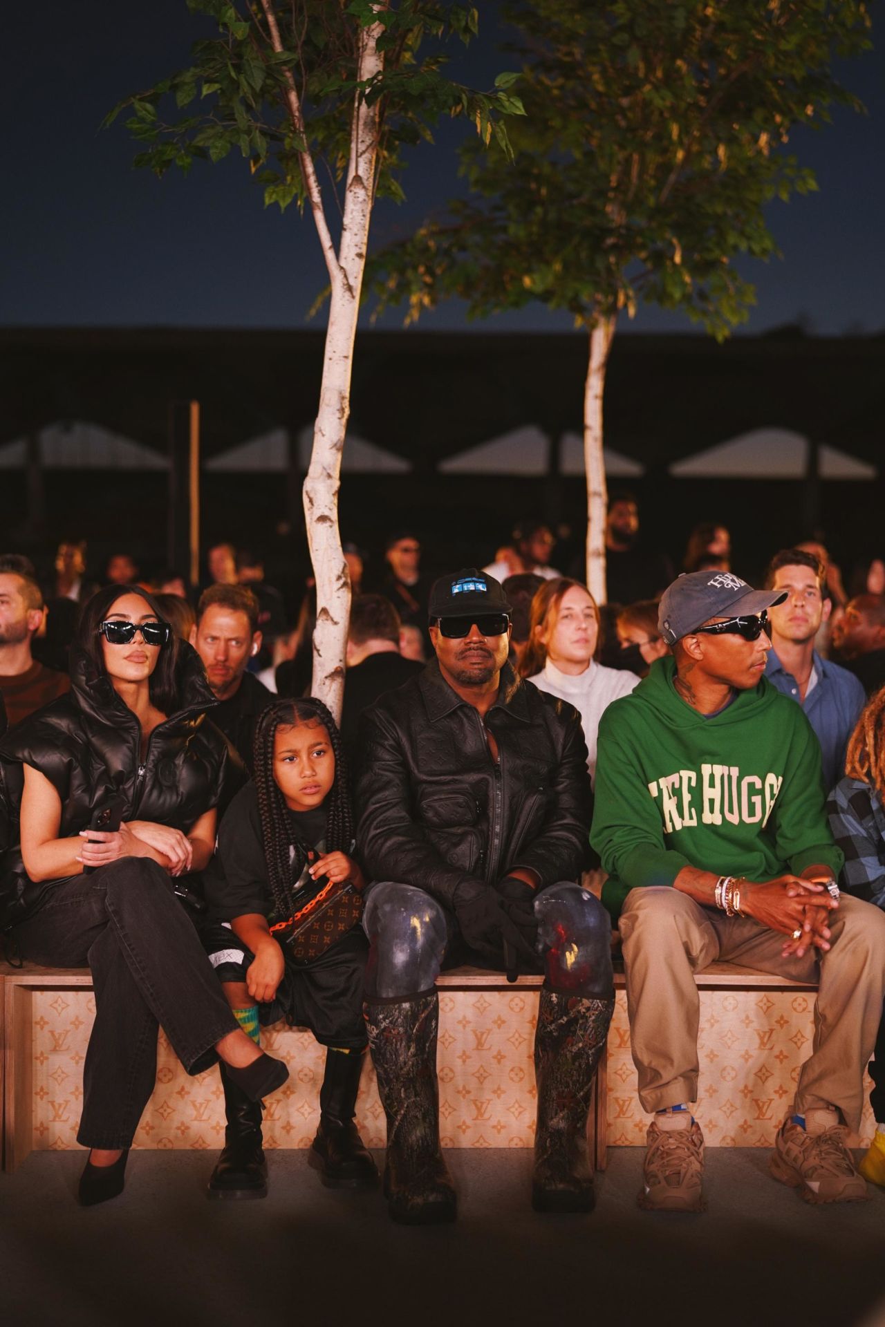 Kim Kardashian-West sat next to her daughter North, separated husband Kanye and musician Pharrell Williams.