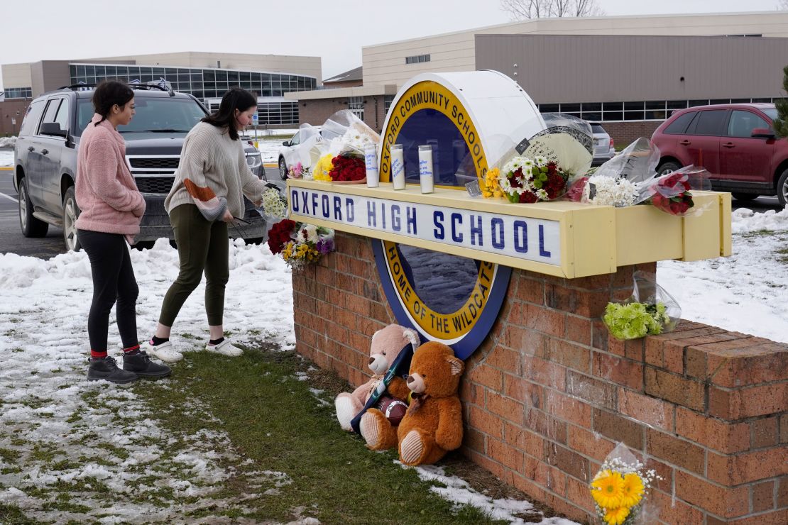 Students leave flowers Wednesday at Oxford High School.