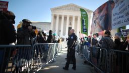 Police use metal barricades to keep protesters, demonstrators and activists apart in front of the Supreme Court as the justices hear hear arguments in Dobbs v. Jackson Women's Health, a case about a Mississippi law that bans most abortions after 15 weeks, on December 1, 2021 in Washington.