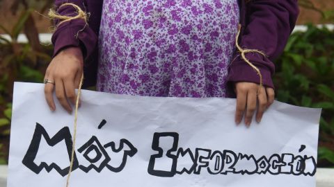 A pregnant teenager holds a sign that reads: "More Information, Better Protection" at a National Child Sexual Exploitation and Abuse Awareness Day demonstration, in Asuncion, Paraguay in 2017.