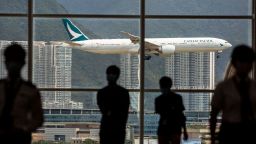 A Cathay Pacific aircraft comes in to land at Hong Kong International Airport on August 11, 2021. (Photo by ISAAC LAWRENCE / AFP) (Photo by ISAAC LAWRENCE/AFP via Getty Images)