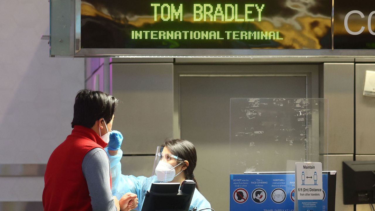 A person is tested for Covid-19 inside the Tom Bradley International Terminal at Los Angeles International Airport on December 01, 2021