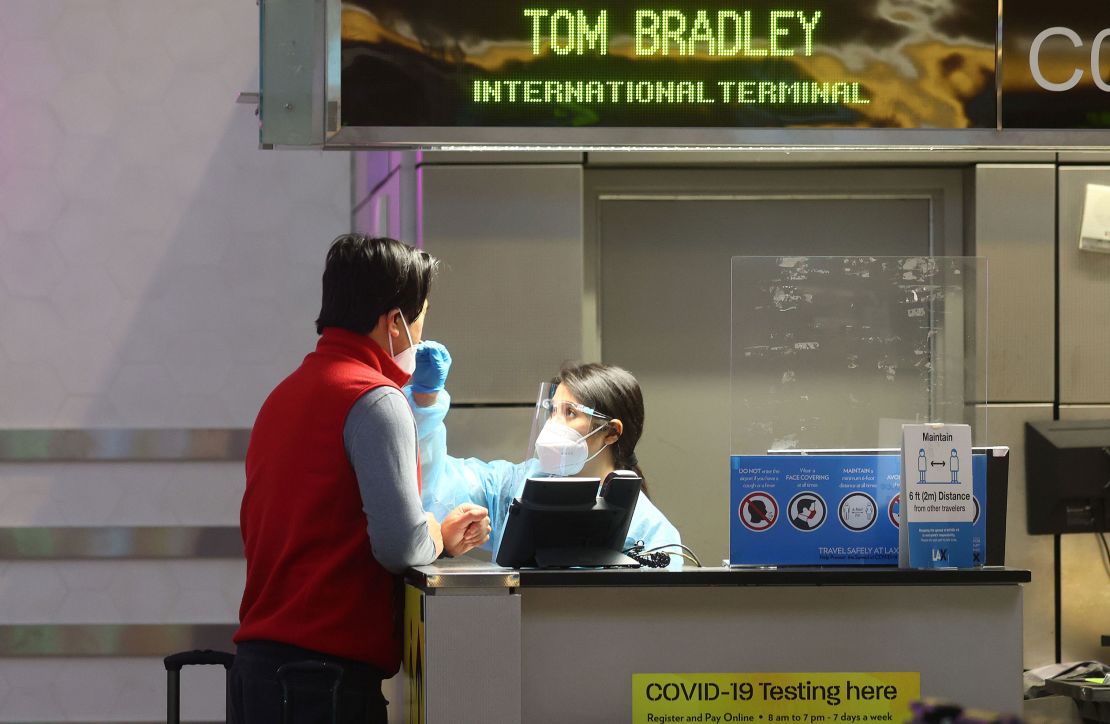 A person is tested for Covid-19 inside the Tom Bradley International Terminal at Los Angeles International Airport on December 01, 2021