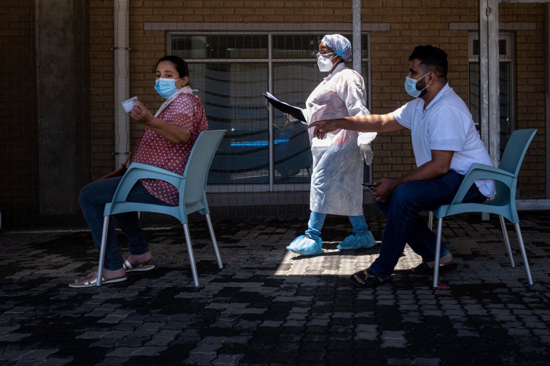 People queue for Covid-19 tests at  Lancet Laboratories in Johannesburg, South Africa, on Tuesday.