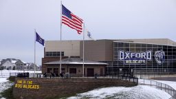 OXFORD, MICHIGAN - DECEMBER 01: Flags fly outside of Oxford High School on December 01, 2021 in Oxford, Michigan. Yesterday, three students were killed and eight others were injured when a gunman opened fire on students at the school. A 15-year-old sophomore, believed to be the only gunman, is in custody,  (Photo by Scott Olson/Getty Images)