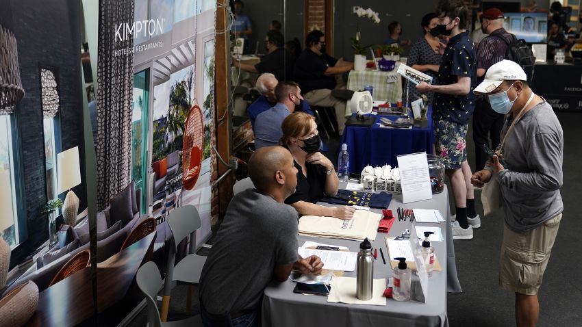 Prospective employers and job seekers interact during a job fair Wednesday, Sept. 22, 2021, in the West Hollywood section of Los Angeles.