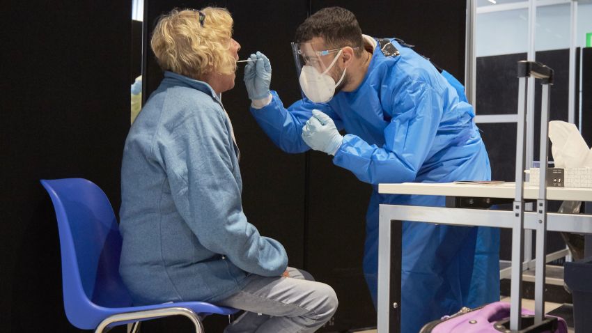 AMSTERDAM, NETHERLANDS - DECEMBER 02: The passenger of a flight from South Africa is tested for the Coronavirus at Amsterdam Schiphol airport on December 2, 2021 in Amsterdam, Netherlands. The Netherlands and other nations worldwide temporarily banned most travellers from South Africa after a new variant of Covid-19 named Omicron was discovered. Omicron has sparked worries around the world that it could resist vaccinations and prolong the nearly two-year Covid-19 pandemic. (Photo by Pierre Crom/Getty Images)