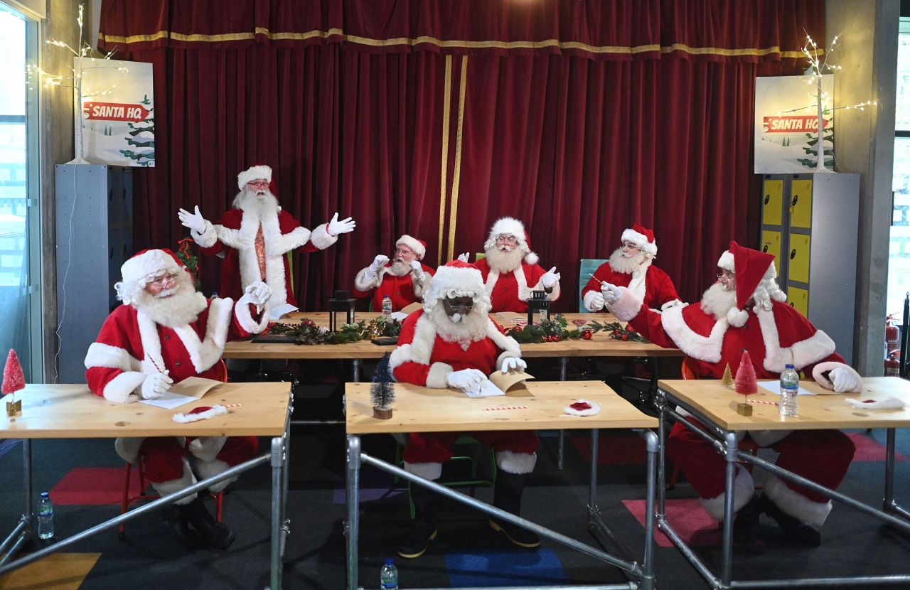 Santas sit in class as they take part in Santa School at The Ministry of Fun in London on Tuesday, November 30.