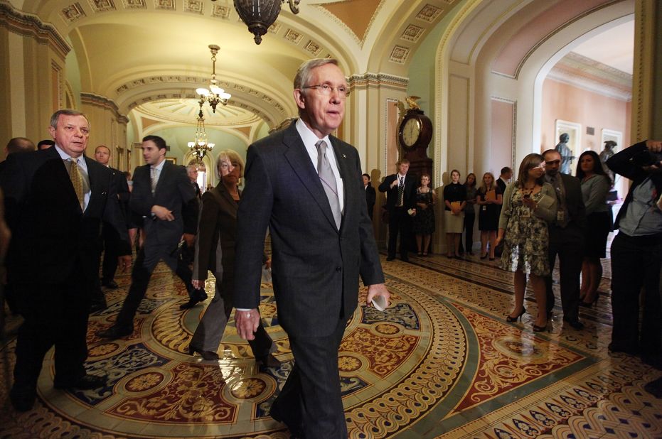 Reid walks over to the media after voting on a bill to raise the debt ceiling in 2011.