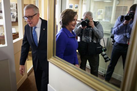 Reid and House Minority Leader Nancy Pelosi arrive for a Capitol news conference in 2015.