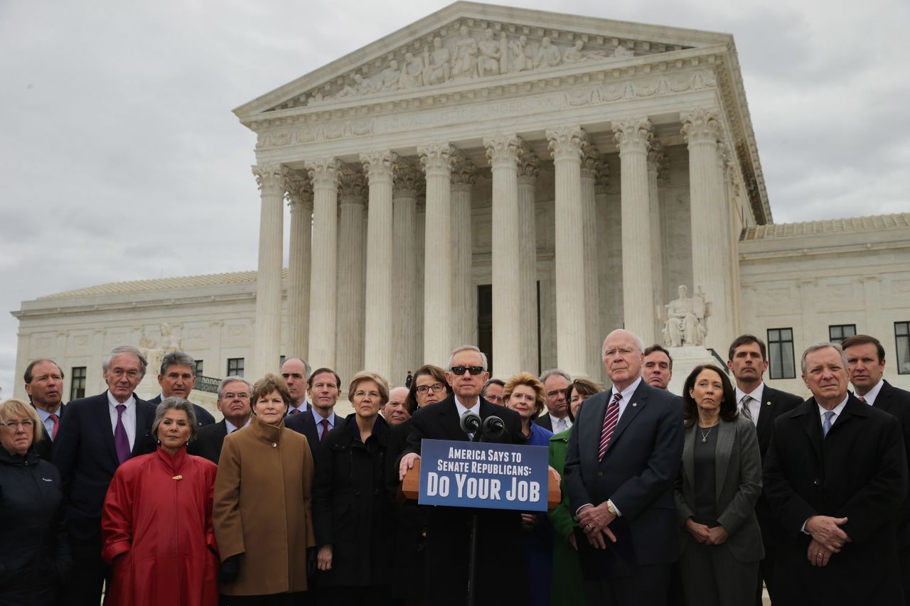 Reid joins other Senate Democrats in front of the Supreme Court in 2016 as they demanded that Senate Republicans hold confirmation hearings for President Obama's new Supreme Court nominee. GOP leaders in the Senate said they would not hold a confirmation hearing after Obama said he would name someone to replace Associate Justice Antonin Scalia, who died earlier that month while on a hunting trip in Texas.