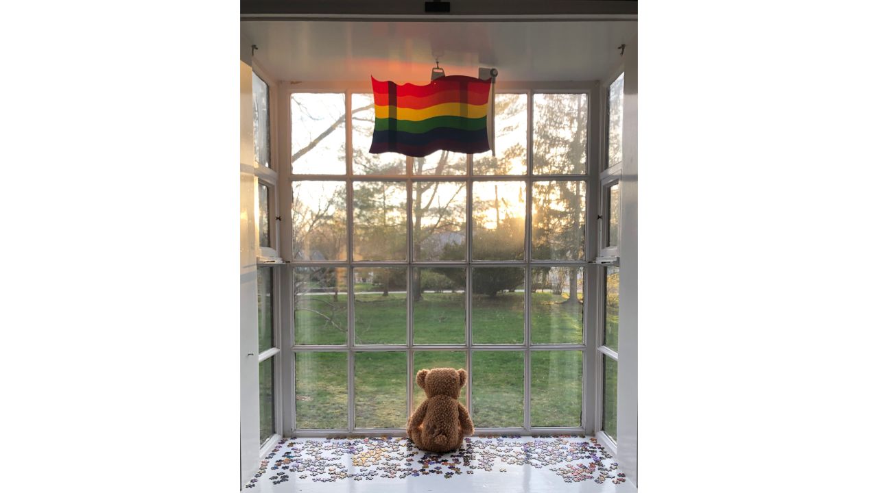 <strong>Corner of the world:</strong> Duriau loves seeing the beautiful photos, but she says it's the stories behind them that really resonate. Chrissy Maher Roberts, took this photo in April 2020 in Hingham, Massachussetts in the USA. "A flag for a local pride project, a teddy bear for kids going on a teddy bear hunt, a puzzle for my mind and a sunset for my soul," wrote Maher Roberts in her caption.