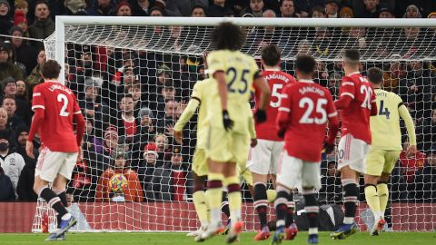 David de Gea lies on the ground as Emile Smith Rowe's shot finds the back of the net.