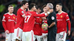 MANCHESTER, ENGLAND - DECEMBER 02: Players of Manchester United interact with Match Referee, Martin Atkinson after a goal scored by Emile Smith Rowe of Arsenal (not pictured) is given following a VAR check during the Premier League match between Manchester United and Arsenal at Old Trafford on December 02, 2021 in Manchester, England. (Photo by Alex Livesey/Getty Images)