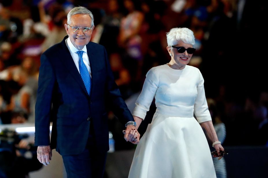 Reid and his wife, Landra, walk off stage after Reid spoke at the Democratic National Convention in 2016. Reid retired the next year.