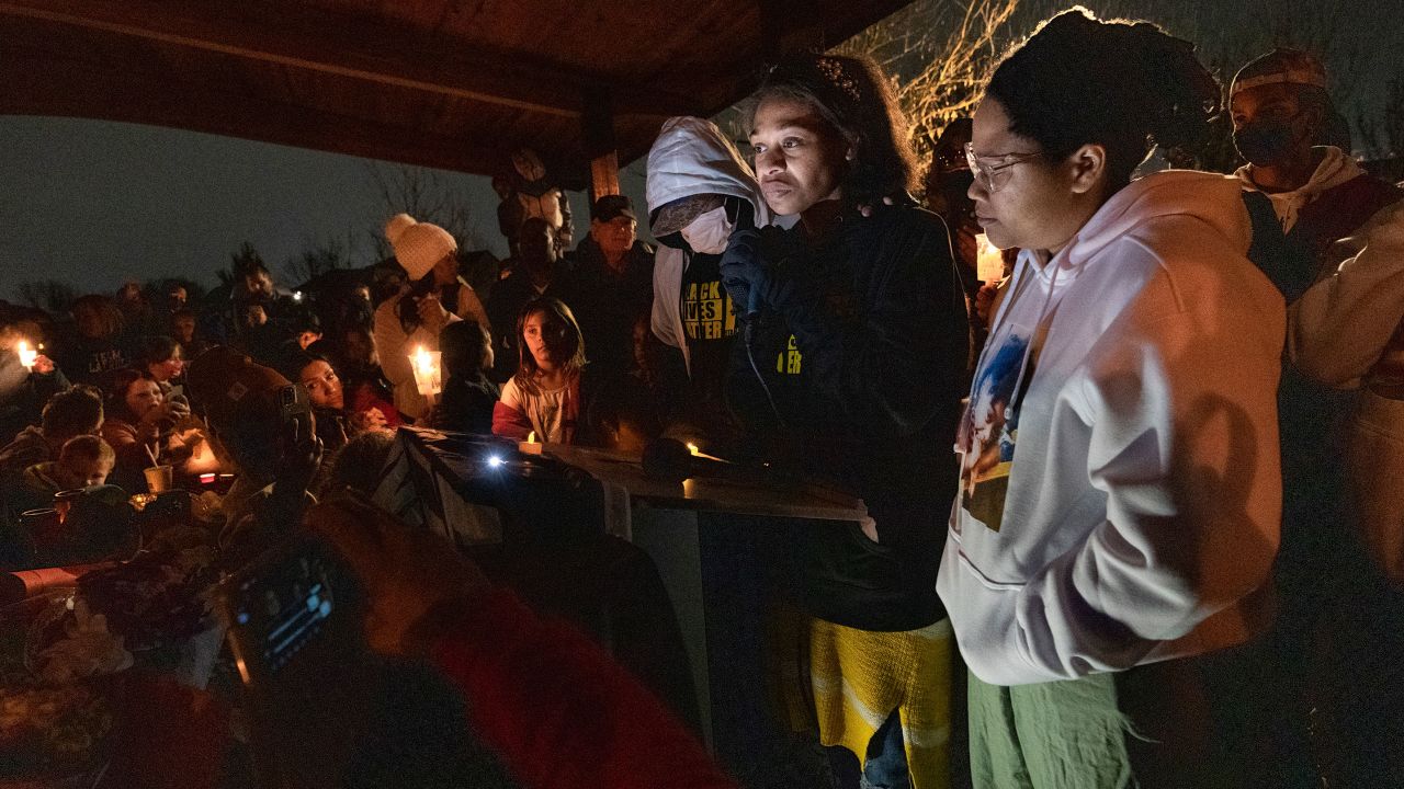 Students and community members joined Brittany Tichenor- Cox, center, during a vigil in North Salt Lake, Utah, last month as she mourned the death of her daughter Isabella "Izzy." The girl's family said she died by suicide after being repeatedly bullied at her Davis County school for being Black and autistic.