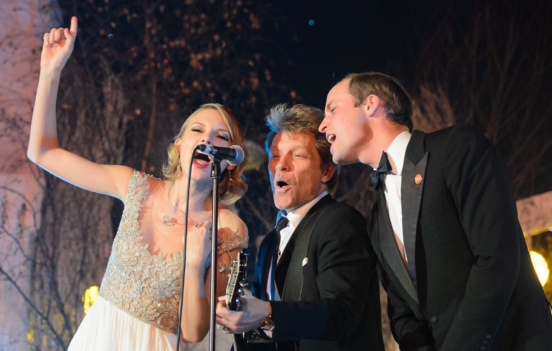The Duke of Cambridge sings with Taylor Swift and Jon Bon Jovi at the Centrepoint Gala Dinner at Kensington Palace in London, on November 26, 2013.