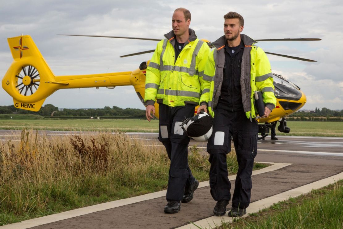 Prince William, left, arrives for his final shift working with the East Anglian Air Ambulance as a pilot at Cambridge Airport, eastern England on July 27, 2017. 