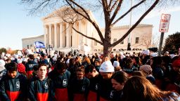 Pro-life students from Liberty University participate in a prayer circle during a protest against abortion rights and Roe v. Wade at the Supreme Court as the justices hear oral arguments in Dobbs v. Jackson Women's Health Organization. They demand that Roe v. Wade be overturned, mostly for religious reasons. JWHO is challenging the constitutionality of a Mississippi law prohibiting abortion after 15 weeks, claiming that it violates the 1973 Roe decision by banning abortion before fetal viability. (Photo by Allison Bailey/NurPhoto via AP)