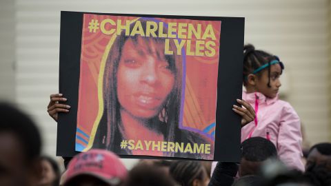 A woman holds a sign in honor of Charleena Lyles during a protest and rally in honor of Lyles on June 20, 2017, in Seattle, Washington.