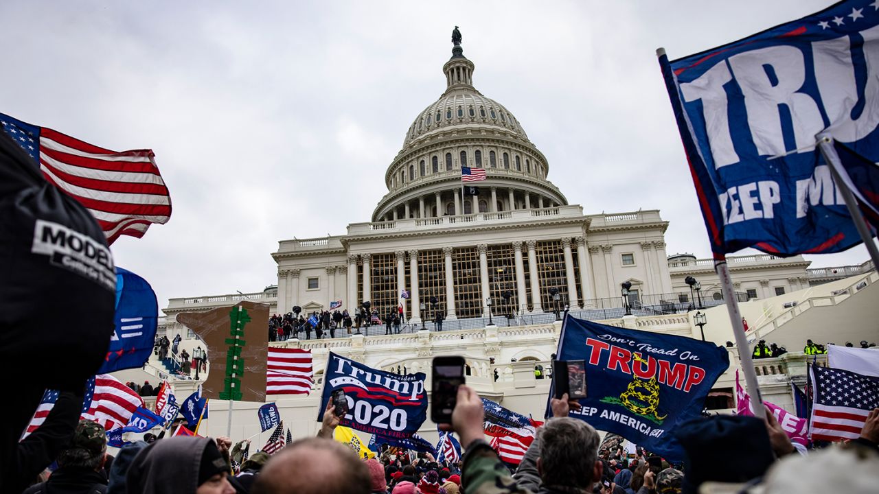 WASHINGTON, DC - JANUARY 06: Pro-Trump supporters storm the U.S. Capitol following a rally with President Donald Trump on January 6, 2021 in Washington, DC. Trump supporters gathered in the nation's capital today to protest the ratification of President-elect Joe Biden's Electoral College victory over President Trump in the 2020 election. (Photo by Samuel Corum/Getty Images)