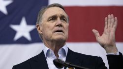 ATLANTA, GA - DECEMBER 14: Sen. David Perdue (R-GA) addresses the crowd during a campaign rally at Peachtree Dekalb Airport on December 14, 2020 in Atlanta, Georgia. As early voting begins, Perdue is facing Democratic candidate Jon Ossoff in a runoff election. The results of two Georgia Senate races will determine the party that controls the majority in the U.S. Senate.  (Photo by Jessica McGowan/Getty Images)