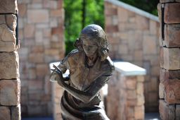 A bronze statue of Anne Frank by sculptor Greg Stone stands on the grounds of the Anne Frank Human Rights Memorial park in Boise, Idaho.