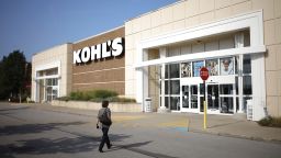 An employee walks towards the front entrance of a Kohl's Corp. department store in Lexington, Kentucky, U.S., on Wednesday, Aug. 11, 2021.