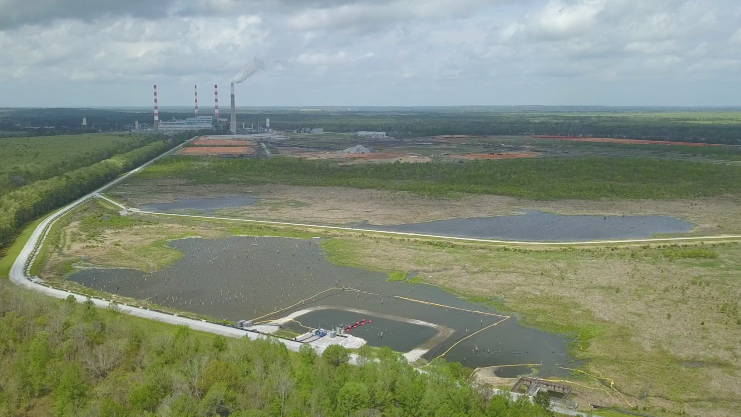 A coal ash pond is shown next to Alabama Power's James M. Barry Electric Generating Plant in Bucks, Alabama.