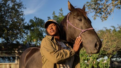 Deydra Steans shown with her horse Cairo as she ends the day at her farm in Luling, Texas, on October 16, 2021.