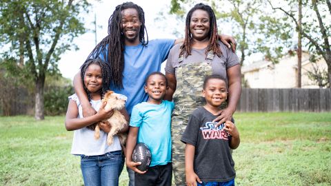 Tiffany Washington and her husband, Roc Zanders, pose with their children Raeghan, Boston and Brayden Zanders. Her daughter holds the family puppy, Roxy. 