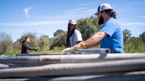 At the old "Kactus Korral," Steans collects pieces from a greenhouse her family purchased for the farm along with partners. This will help with the year-round growth of crops.