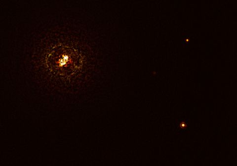This image shows double-star system b Centauri and its giant planet b Centauri b. The star pair is the bright object at top left. The planet is visible as a bright dot in the lower right. The other bright dot (top right) is a background star.