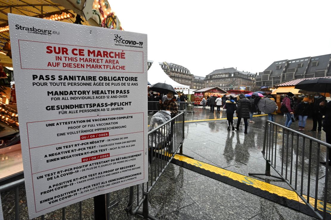 Customers have health passes checked before entering the traditional Christmas market in Strasbourg, France, on December 4, 2021.