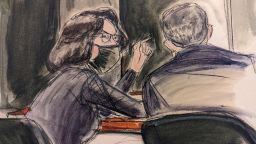 In this sketch, Ghislaine Maxwell, seated left speaks to her defense attorney Christian Everdell prior to the testimony of "Kate,"during the trial of Ghislaine Maxwell, Monday, Dec. 6, 2021, in New York. Maxwell 's family have written to Attorney General Merrick B. Garland requesting that authorities stop using four-point restraints to shackle her hands, waist and feet when she is moved from a holding cell to the courtroom, and that she receive a food pack and a bar of soap each day. (Elizabeth Williams via AP)