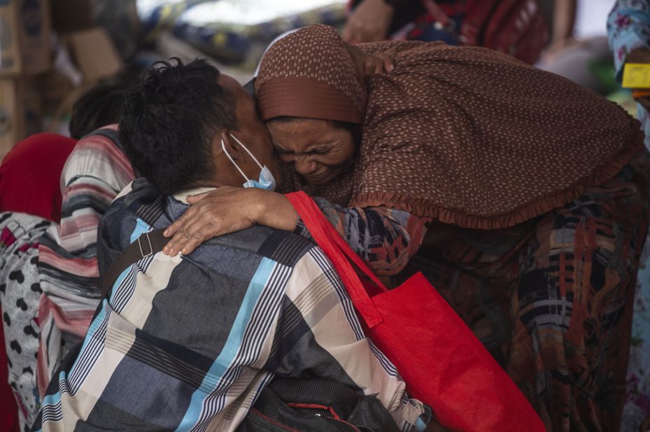 Villagers gather at a makeshift shelter in the Sumberwuluh village on Monday.
