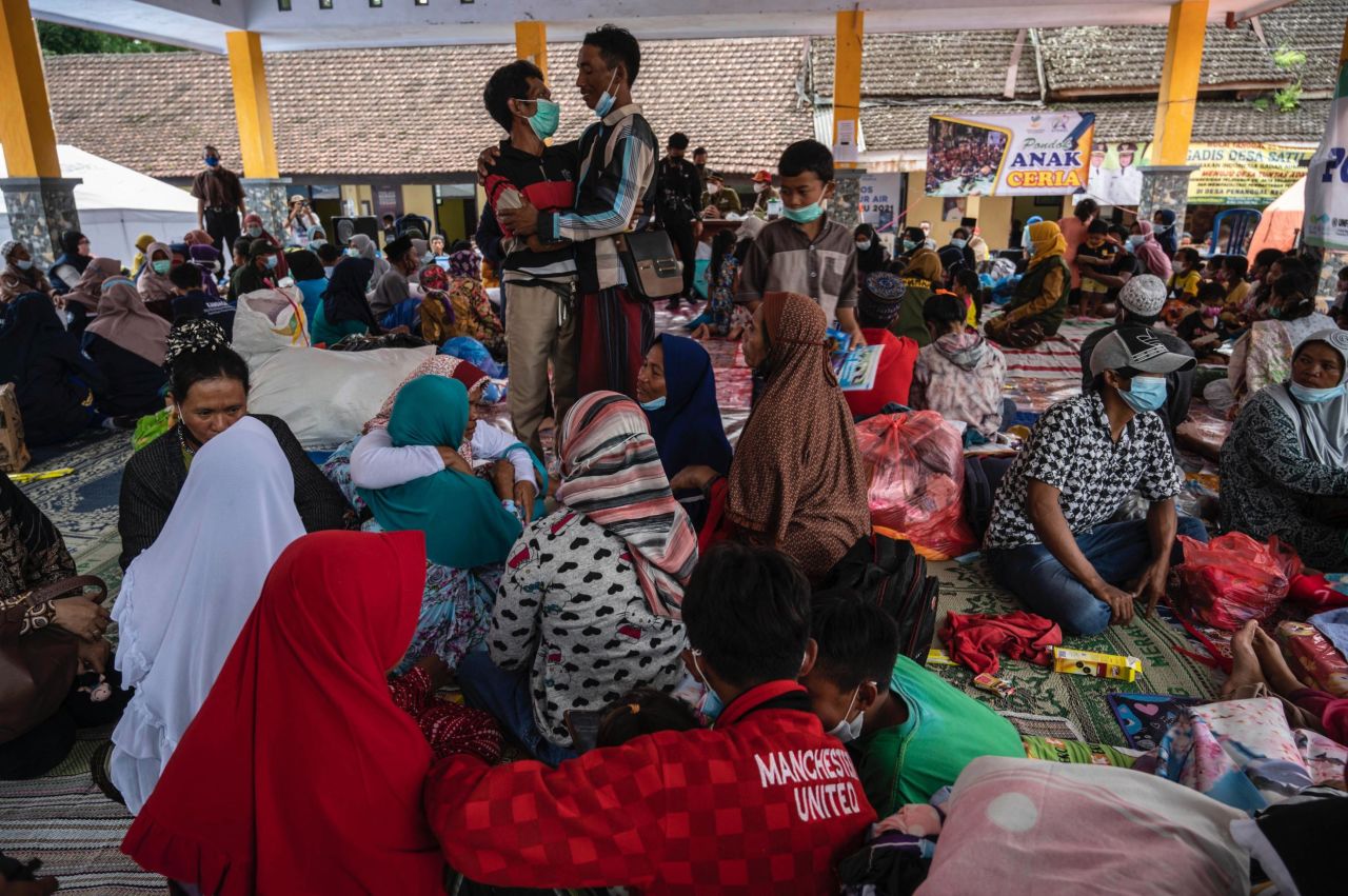 Villagers gather at a shelter in Sumberwuluh.