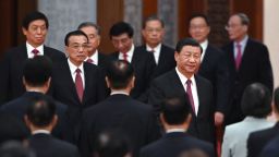 Chinese President Xi Jinping (R) arrives with Premier Li Keqiang (L) and members of the Politburo Standing Committee for a reception at the Great Hall of the People in Beijing on the eve of China's National Day on September 30, 2021. (Photo by GREG BAKER / AFP) (Photo by GREG BAKER/AFP via Getty Images)