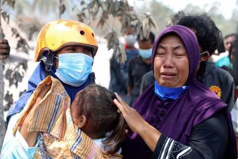 A woman weeps after her home was destroyed by the eruption of Mount Semeru in Candi Puro village, Lumajang, East Java, Indonesia, on Tuesday.