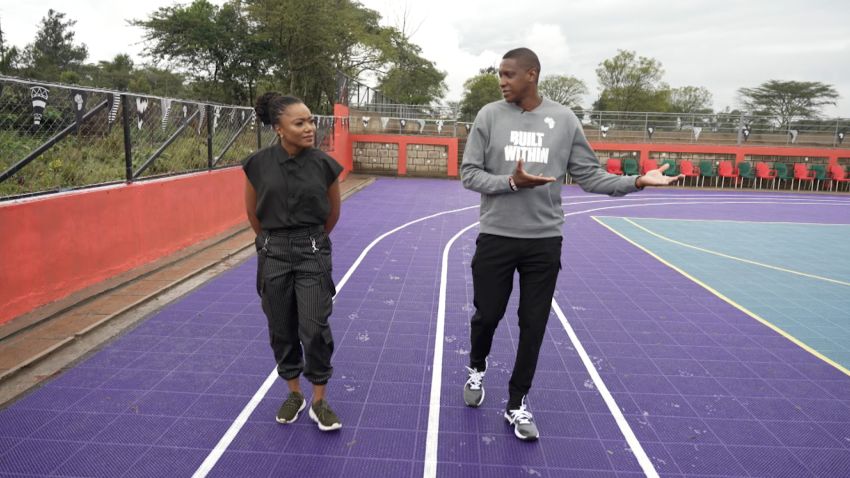 Masai Ujiri showing Arit Okpo a new basketball court built in Kenya by his organization.