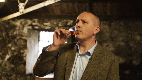 Edward Thom, the Glenmorangie Distillery manager, taking a sip of whiskey straight from the cask.
