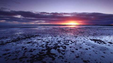 The sun rising over the Dornoch Firth, north of Inverness, Scotland. 