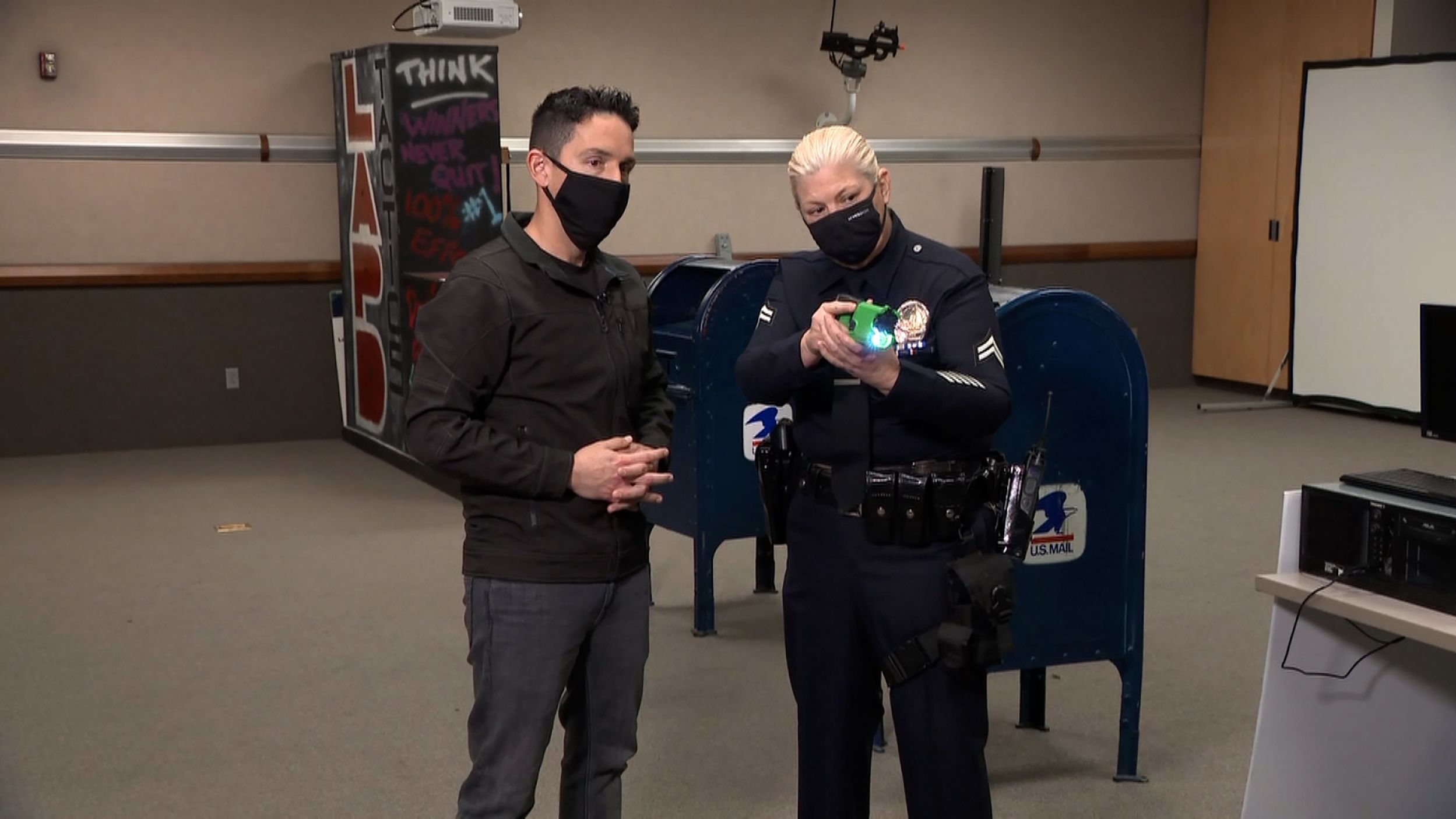 LAPD Officer Allison Ashnault shows CNN's Josh Campbell the firing of a Taser.
