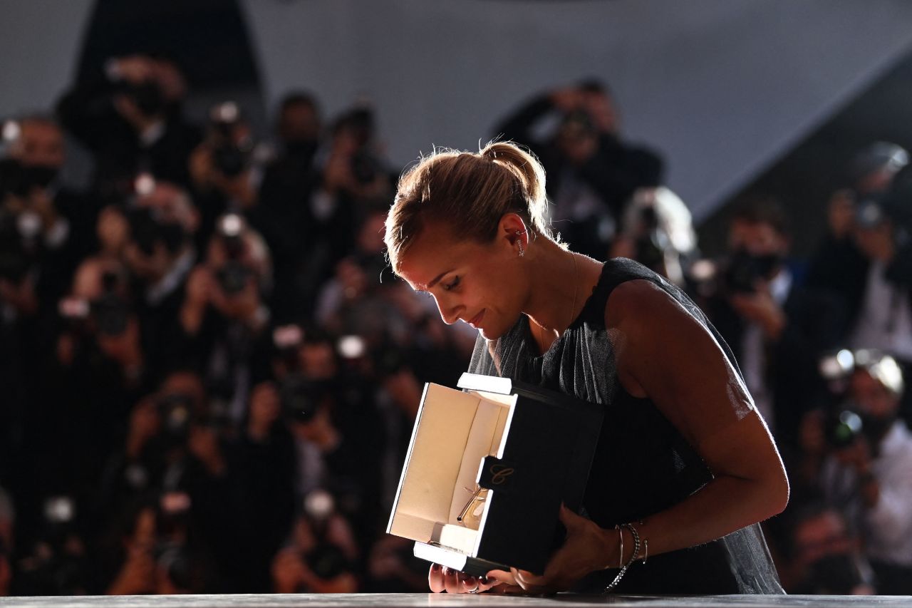 French director Julia Ducournau looks at her Palme d'Or for "Titane" at the closing ceremony of the 74th edition of the Cannes Film Festival in Cannes, France, on July 17, 2021.